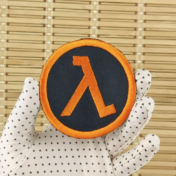 medium Half Life Orange Lambda symbol Embroidered Patch on holding hand