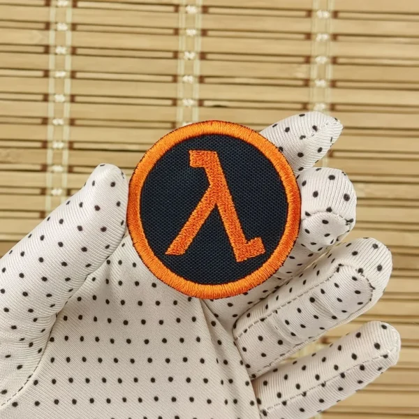 small Half Life Orange Lambda symbol Embroidered Patch on holding hand