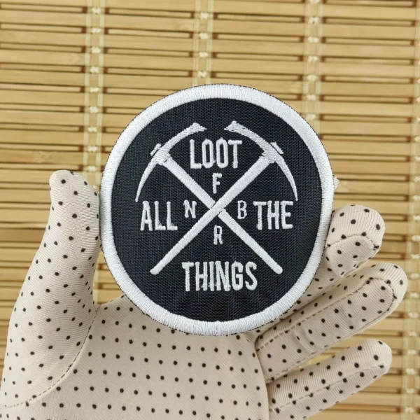 Loot All Things Embroidered Patch on holding hand