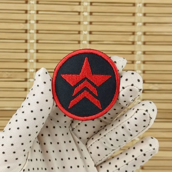 Small Renegade Logo Embroidered Patch on holding hand