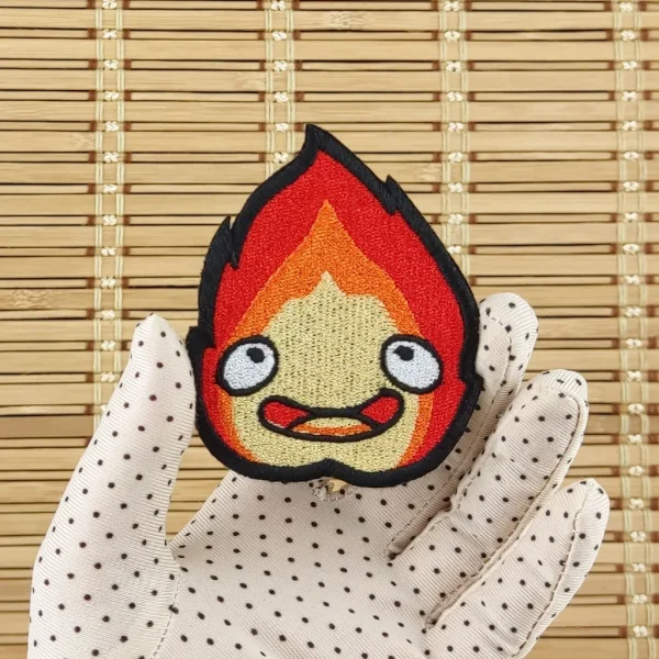 medium Calcifer Anime Kawaii Fire Embroidered Patch on holding hand