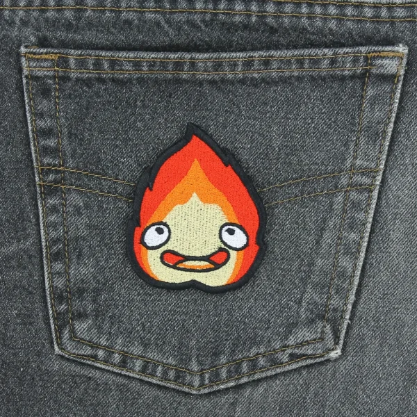 medium Calcifer Anime Kawaii Fire Embroidered Patch on black jeans