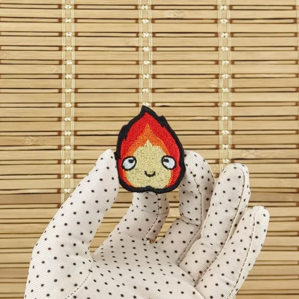 small Calcifer Anime Kawaii Fire Embroidered Patch on holding hand