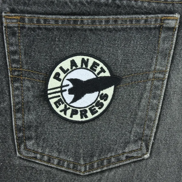 Planet Express Embroidered Patch on black jeans