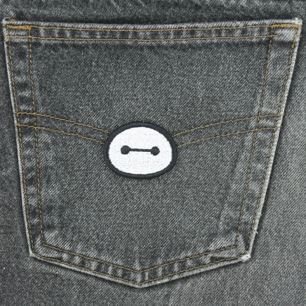 Small Baymax Kawaii Robot Embroidered Patch on black jeans