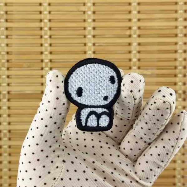 Small Kodama Embroidered Patch on holding hand