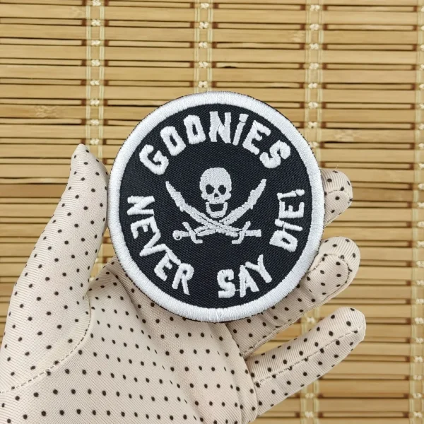 Goonies Never Die Embroidered Patch on holding hand