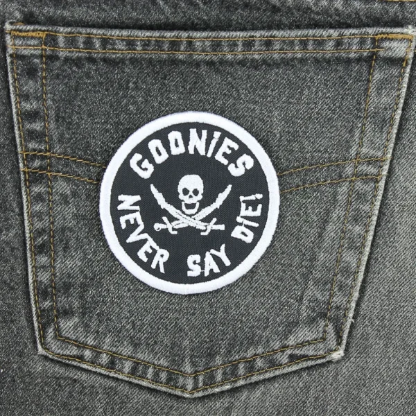 Goonies Never Die Embroidered Patch on black jeans