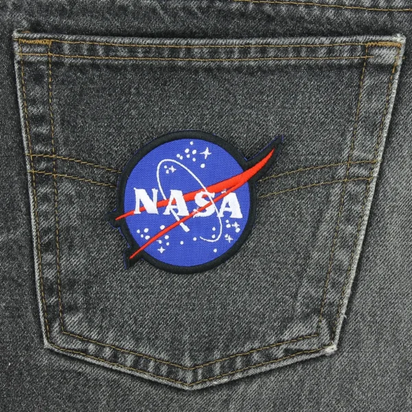 NASA Embroidered Patch on black jeans