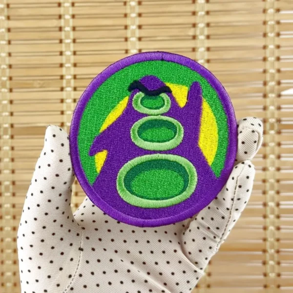 Day of the Tentacle Purple Tentacle Embroidered Patch on holding hand