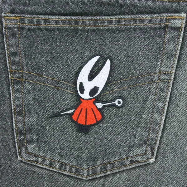 Hollow Knight Hornet Embroidered Patch on black jeans