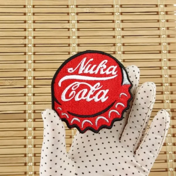 medium Fallout Nuka Cola Cap Embroidered Patch on holding hand