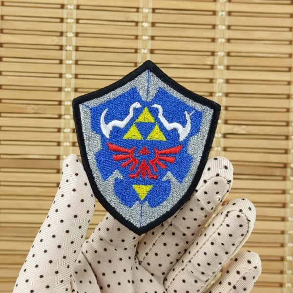 Triforce Fantasy Shield Embroidered Patch on holding hand