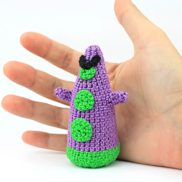 Evil Tentacle Crochet Amigurumi in purple on hand