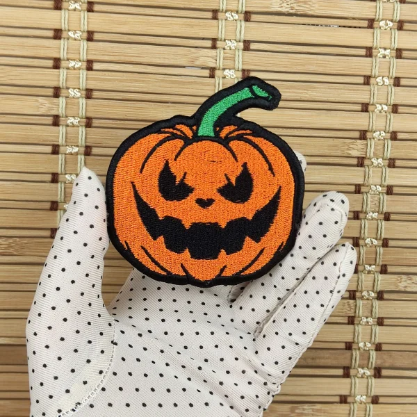 medium Evil Pumpkin Embroidered Patch on holding hand