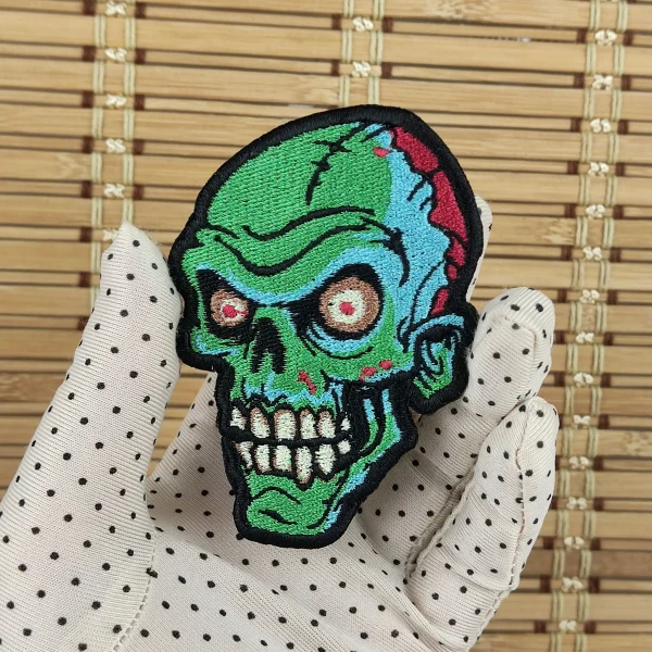 bald Bald Zombie Head Embroidered Patch on holding hand