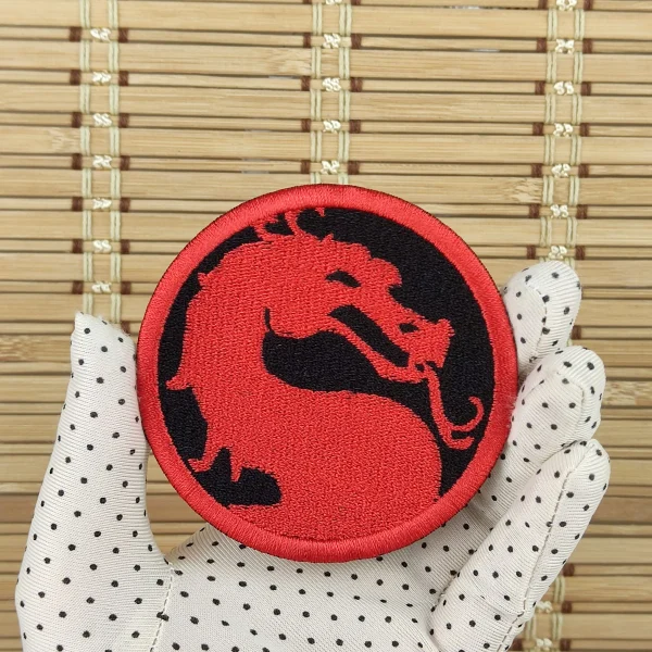 Red Dragon Embroidered Patch on holding hand