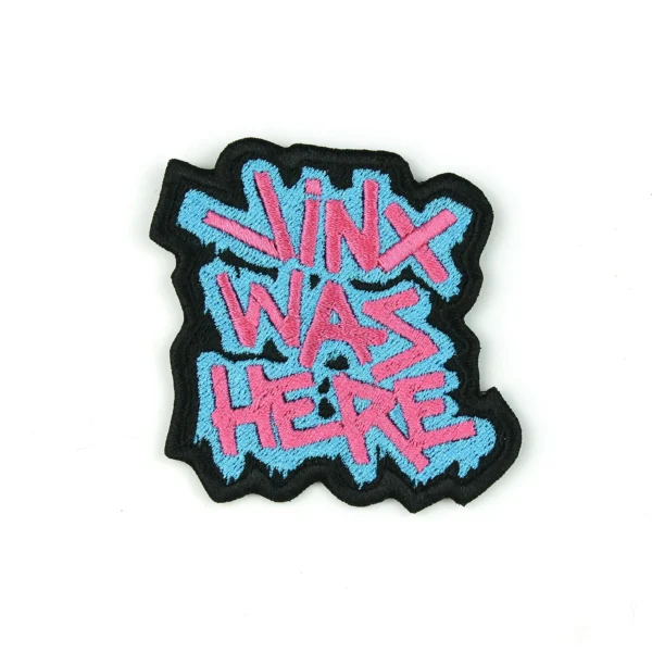 embroidered patch of the phrase "jinx was here" by arkane, league of legends on a white background