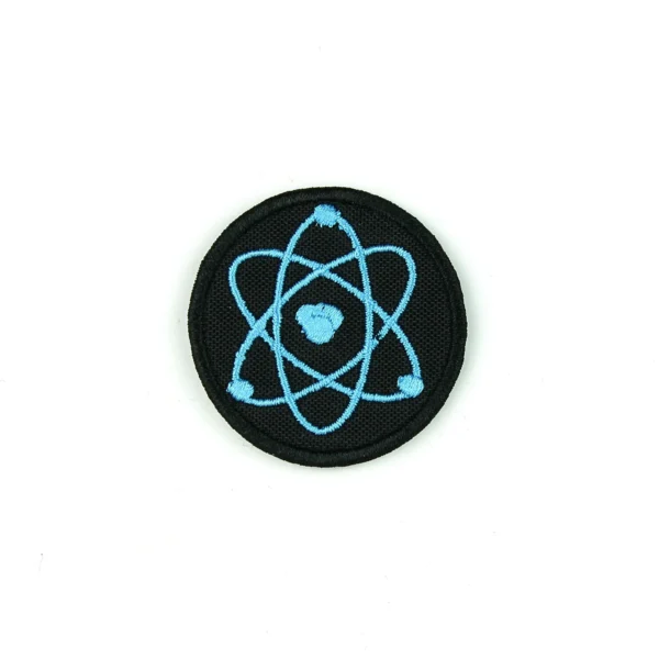 Blue atom embroidered patch on white background