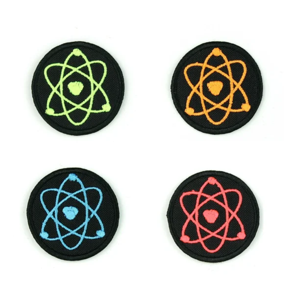 Embroidered patch of multi-colored atoms on a white background